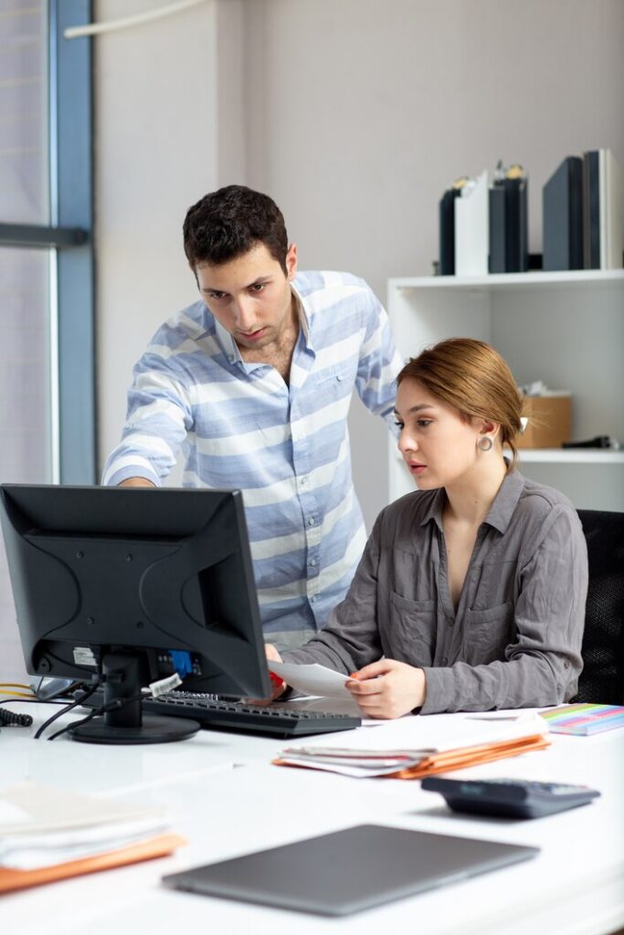 girl and boy doing work in office girl and boy doing work in office